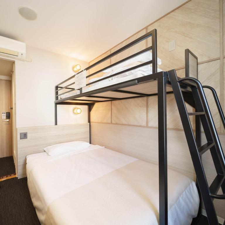 Postel nebo postele na pokoji v ubytování Super Hotel Hida Takayama