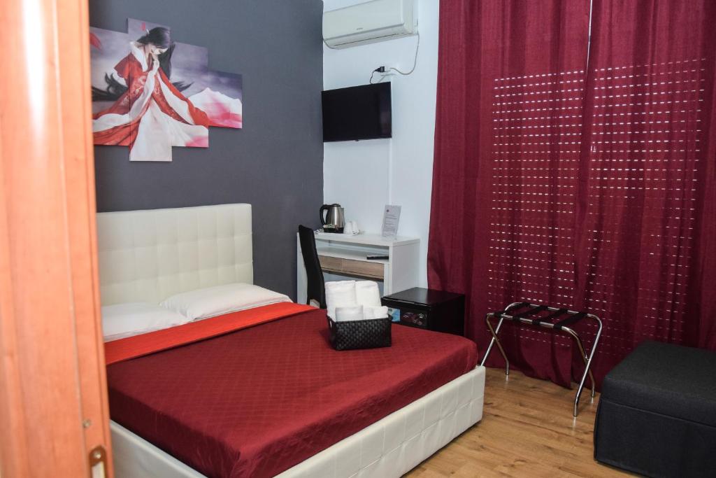 Postel nebo postele na pokoji v ubytování Hotel Kennedy