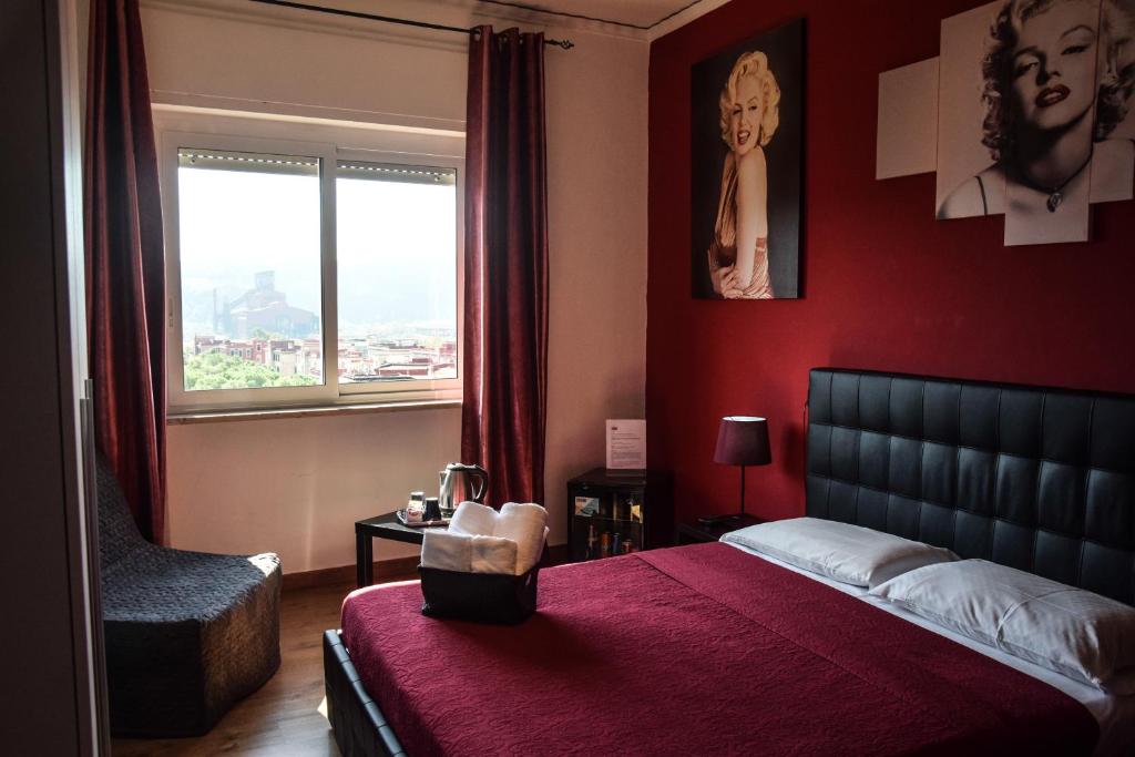 Postel nebo postele na pokoji v ubytování Hotel Kennedy