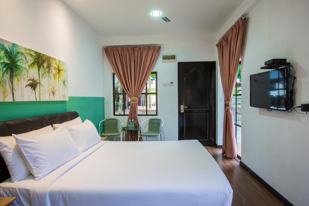 Postel nebo postele na pokoji v ubytování Sayong Resort