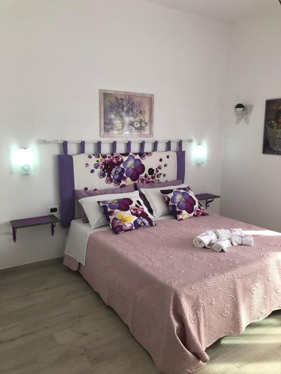 Postel nebo postele na pokoji v ubytování Casa Violet per Civita
