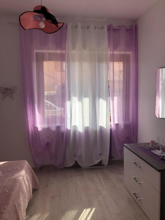 Postel nebo postele na pokoji v ubytování Casa Violet per Civita