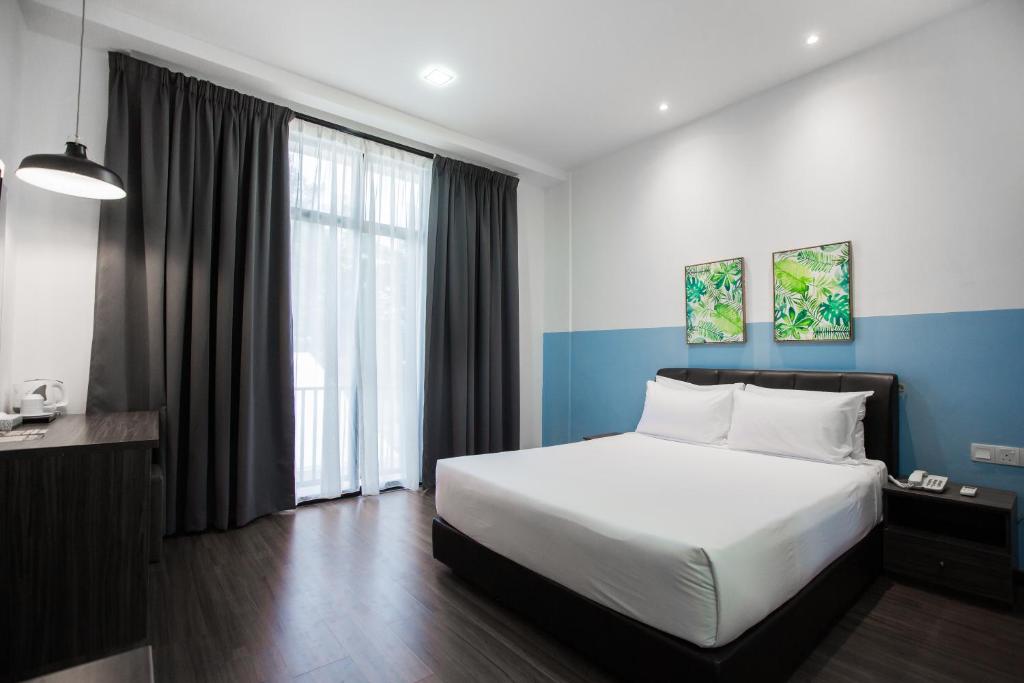 Postel nebo postele na pokoji v ubytování Sayong Resort