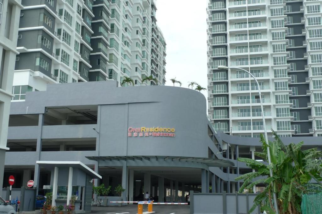 a building in a city with tall buildings at Sekinchan Guest Room 2R1B 4Pax with View in Sekincan