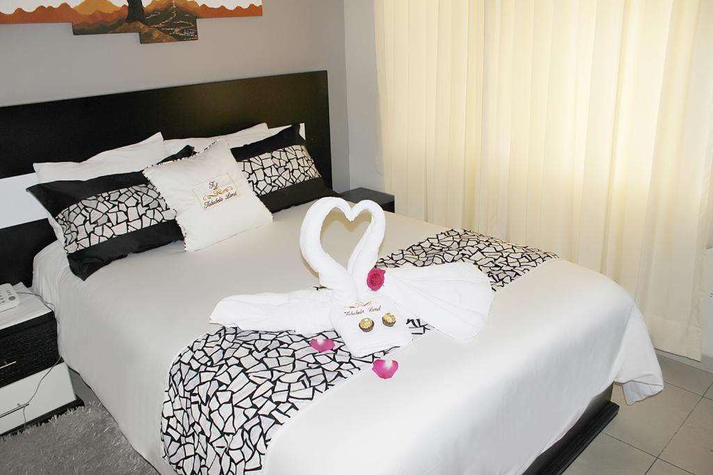 Postel nebo postele na pokoji v ubytování Hotel Tababela Land