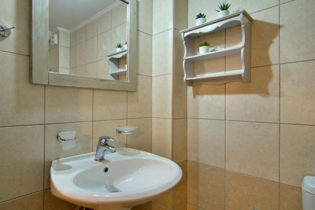 Koupelna v ubytování Xani Hotel