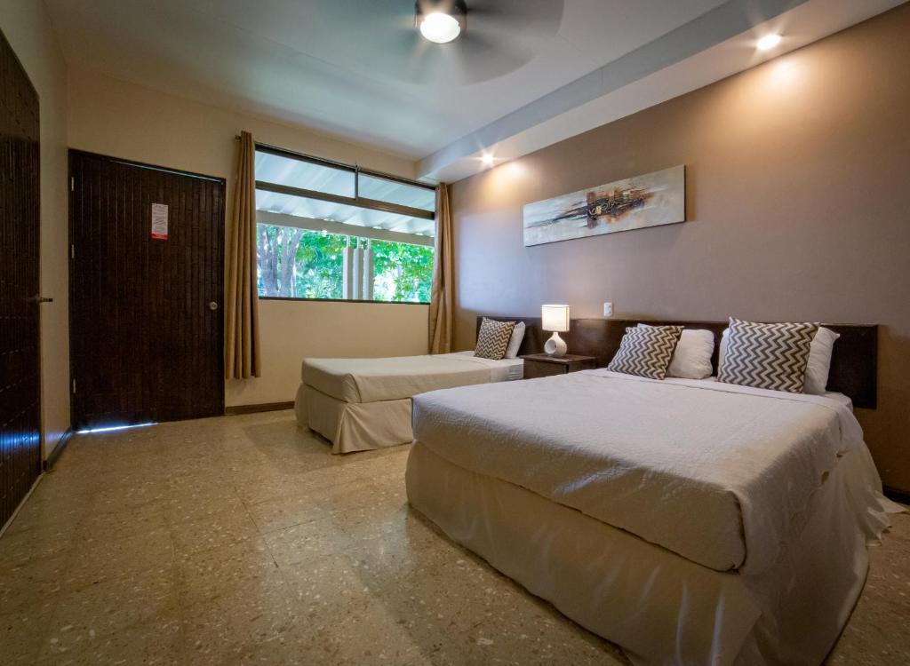 Postel nebo postele na pokoji v ubytování Hotel Diriá Santa Cruz