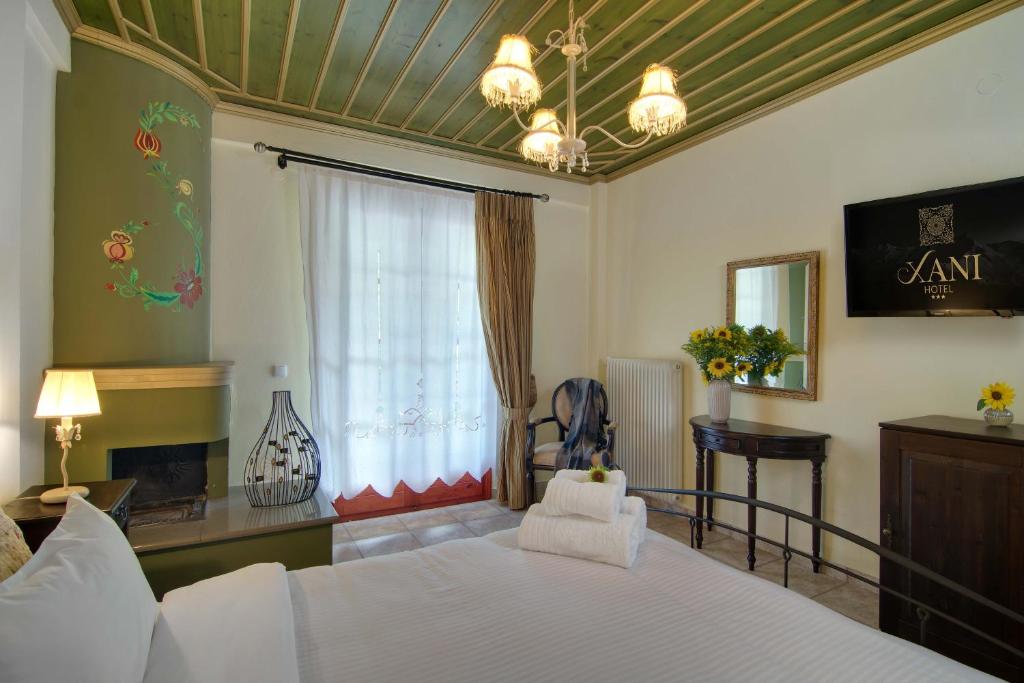 Postel nebo postele na pokoji v ubytování Xani Hotel