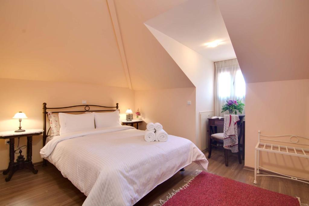 Postel nebo postele na pokoji v ubytování Xani Hotel