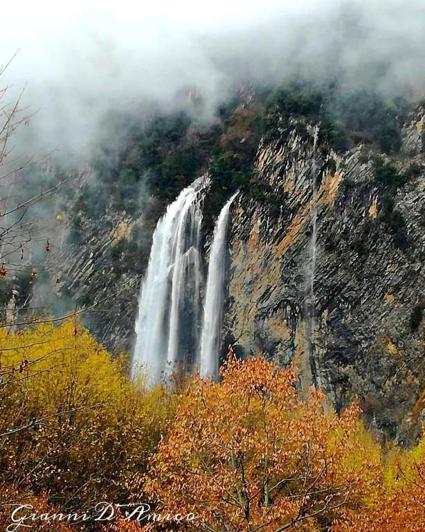 a waterfall on the side of a mountain at Rifugio lo Schioppo in Morino