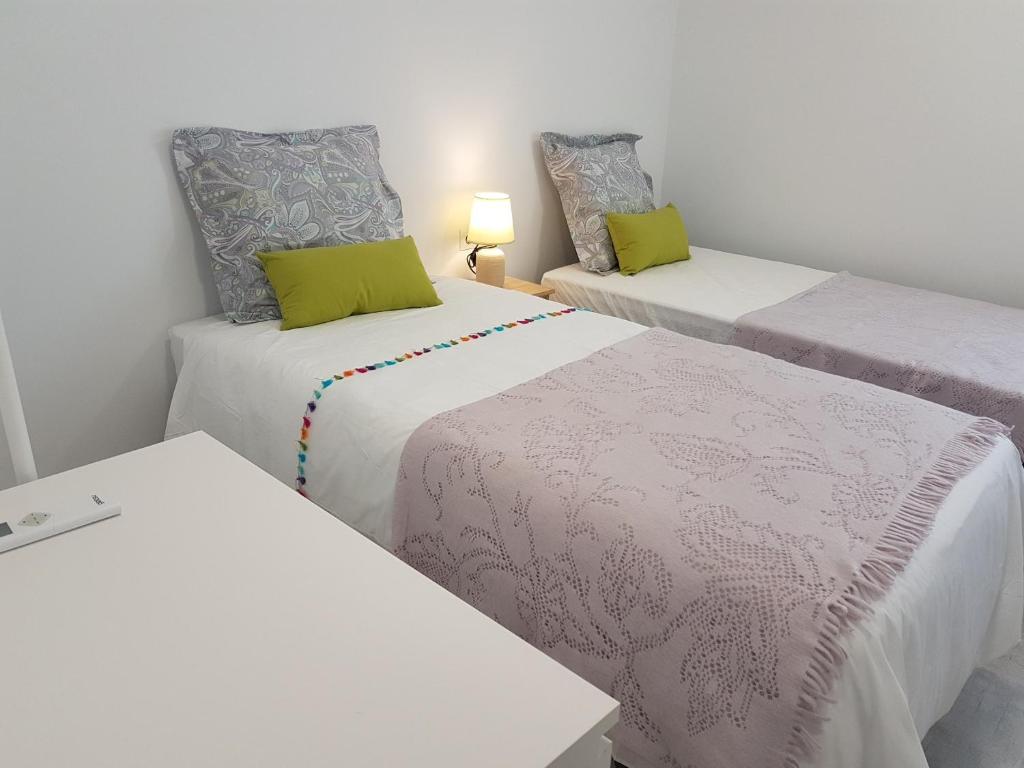 A bed or beds in a room at SHERRY HOME