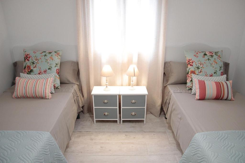 A bed or beds in a room at SHERRY HOME