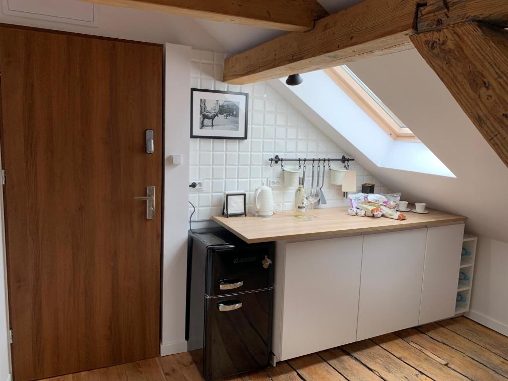 Kuchyňa alebo kuchynka v ubytovaní Apartamenty Jęczmienna 29