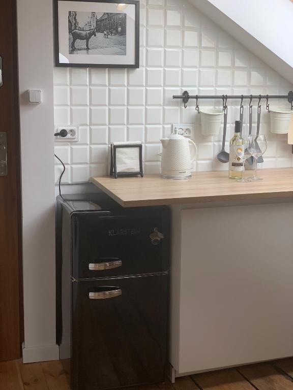 Kuchyňa alebo kuchynka v ubytovaní Apartamenty Jęczmienna 29