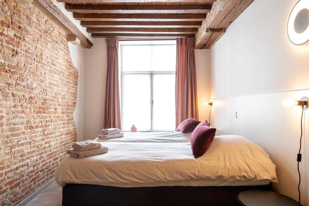 Postel nebo postele na pokoji v ubytování La Clé Brugge