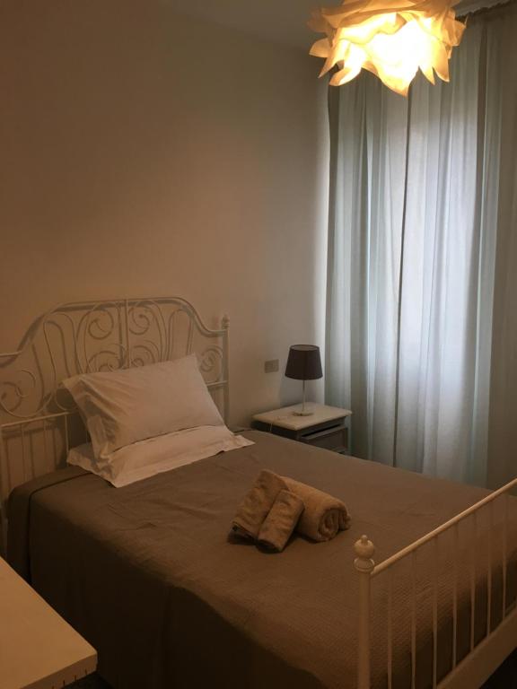 Łóżko lub łóżka w pokoju w obiekcie Via Mazzini