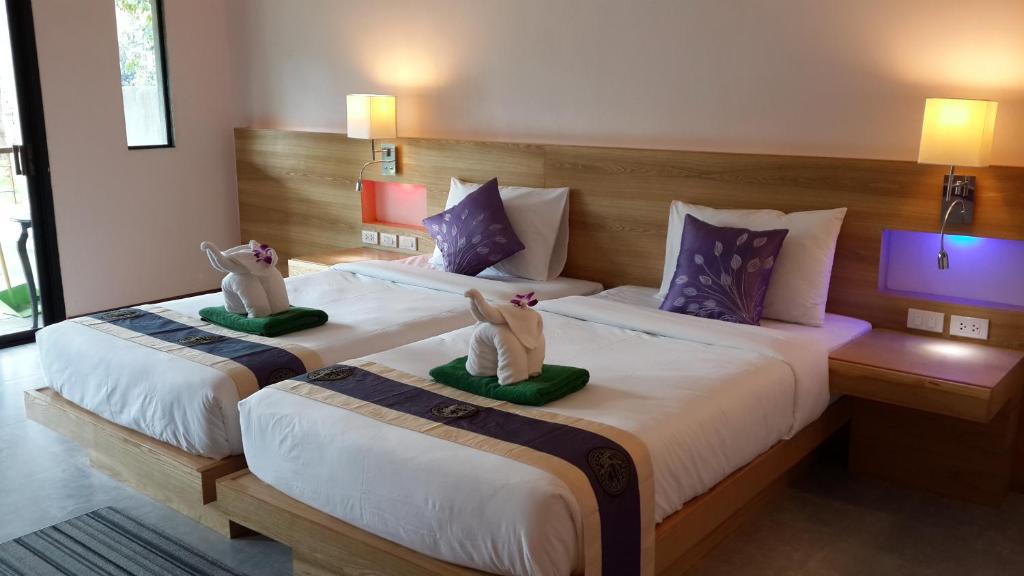 Postel nebo postele na pokoji v ubytování Khaolak Yama Resort - SHA Plus