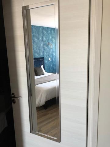 Postel nebo postele na pokoji v ubytování Hôtel L'ange de la vallée