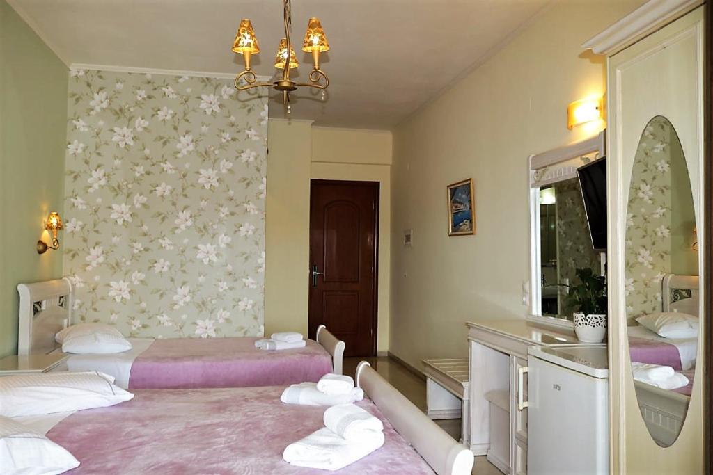 Posteľ alebo postele v izbe v ubytovaní Hotel Maistrali