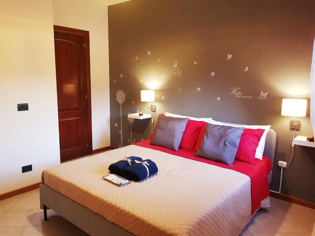 a bedroom with a large bed with a large headboard at Il Teatro in Avezzano