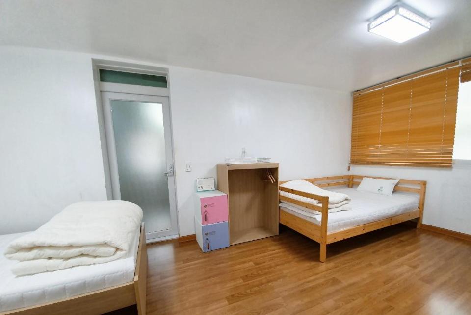 Postel nebo postele na pokoji v ubytování Byulbam Guesthouse