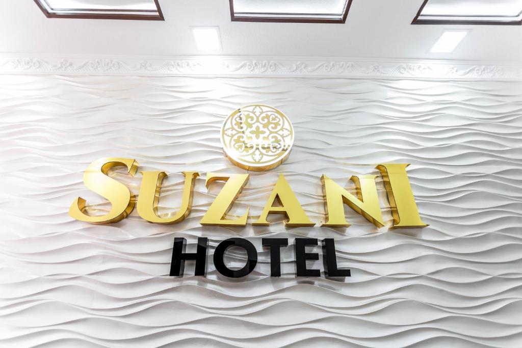 a rendering of a sign for a hotel on the water at Hotel Suzani Samarkand in Samarkand