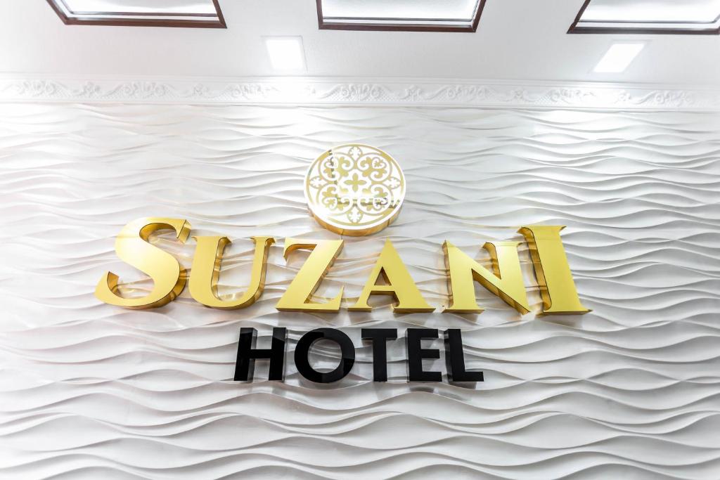 een weergave van een bord voor een hotel aan het water bij Hotel Suzani Samarkand in Samarkand