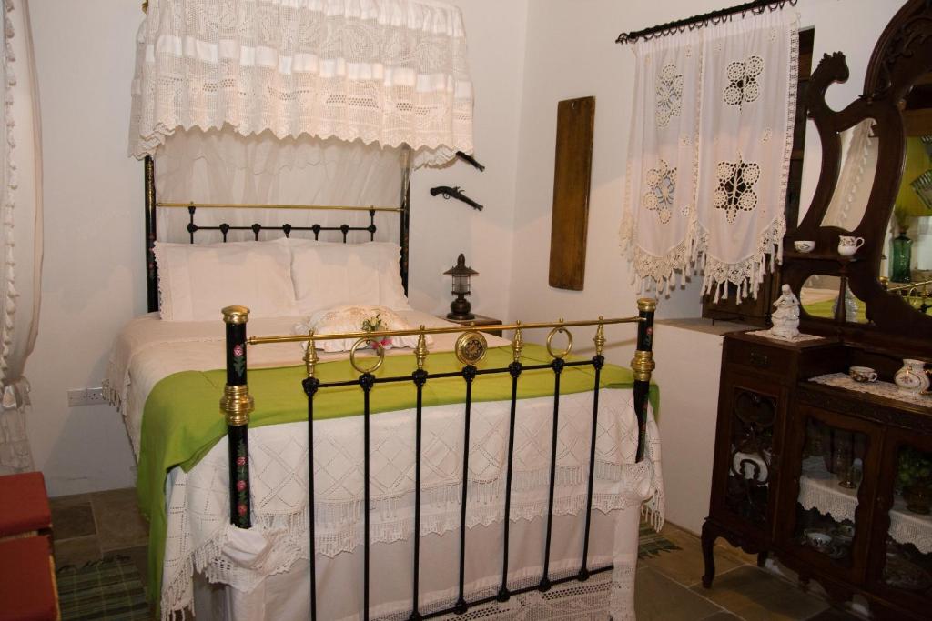 Postel nebo postele na pokoji v ubytování Xenios Cottages