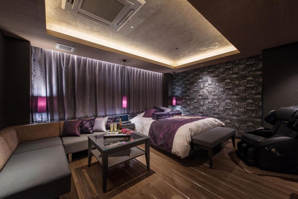 Postel nebo postele na pokoji v ubytování HOTEL ZEN HIRANO (Adult Only)