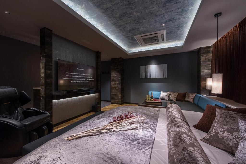Postel nebo postele na pokoji v ubytování HOTEL ZEN HIRANO (Adult Only)
