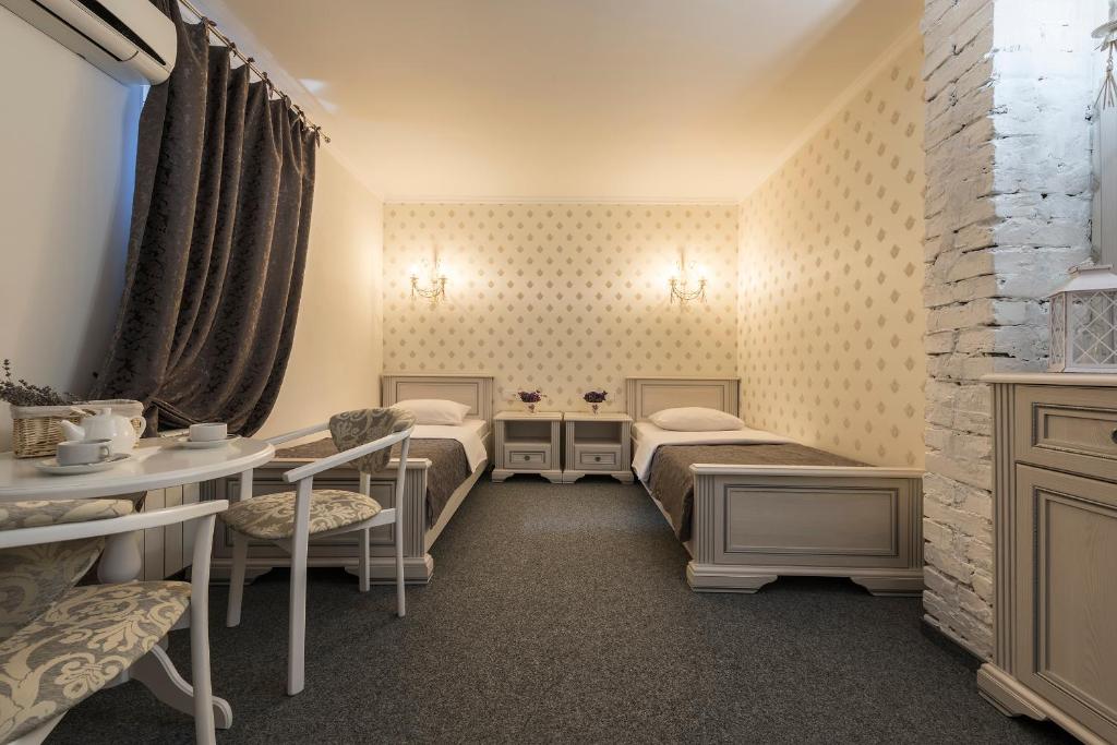 Postel nebo postele na pokoji v ubytování Mini Hotel Ryleev
