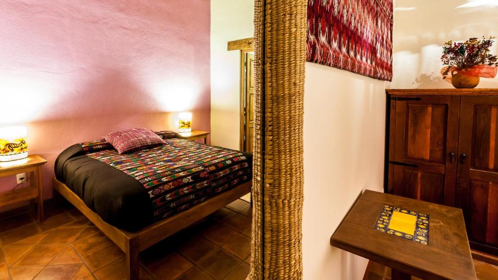 Postel nebo postele na pokoji v ubytování Posada Yolihuani