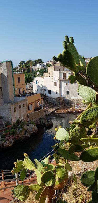 a view of a river in a city with buildings at La Caletta in Santa Flavia