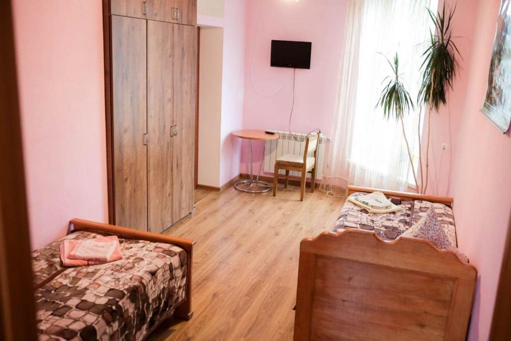 Postel nebo postele na pokoji v ubytování Дідів Рай