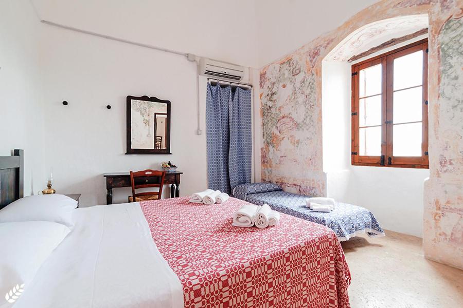 Postel nebo postele na pokoji v ubytování Terra di Leuca