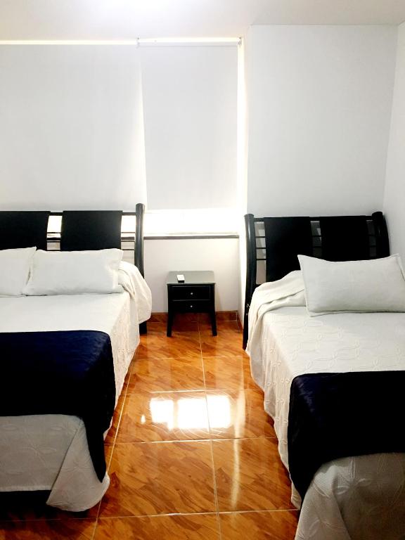 Postel nebo postele na pokoji v ubytování Hotel Casa Paulina