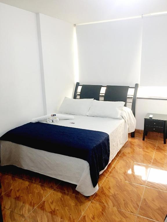 Postel nebo postele na pokoji v ubytování Hotel Casa Paulina