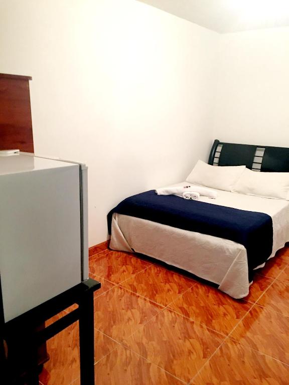 Postel nebo postele na pokoji v ubytování Hotel Casa Paulina