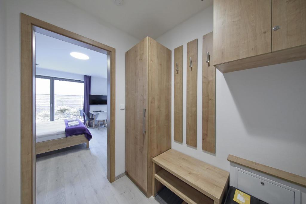 Postel nebo postele na pokoji v ubytování Apartmány Terasy Café
