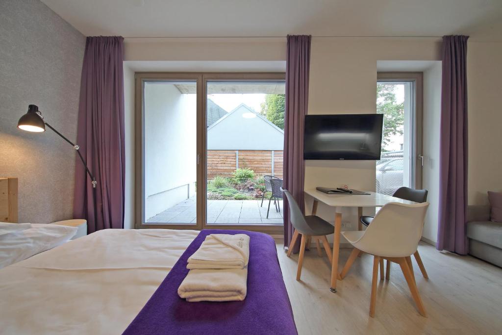 Postel nebo postele na pokoji v ubytování Apartmány Terasy Café