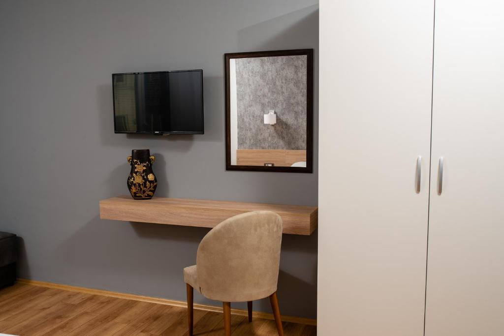 TV a/nebo společenská místnost v ubytování Apartments Bashoski