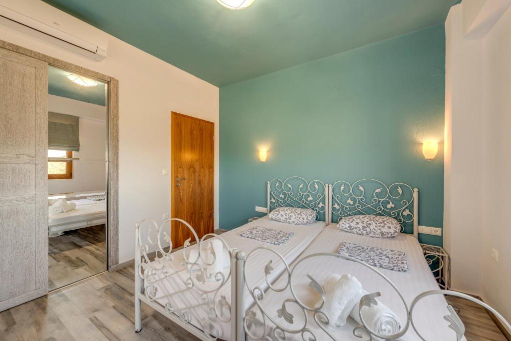 Posteľ alebo postele v izbe v ubytovaní Harmony Deluxe Villas