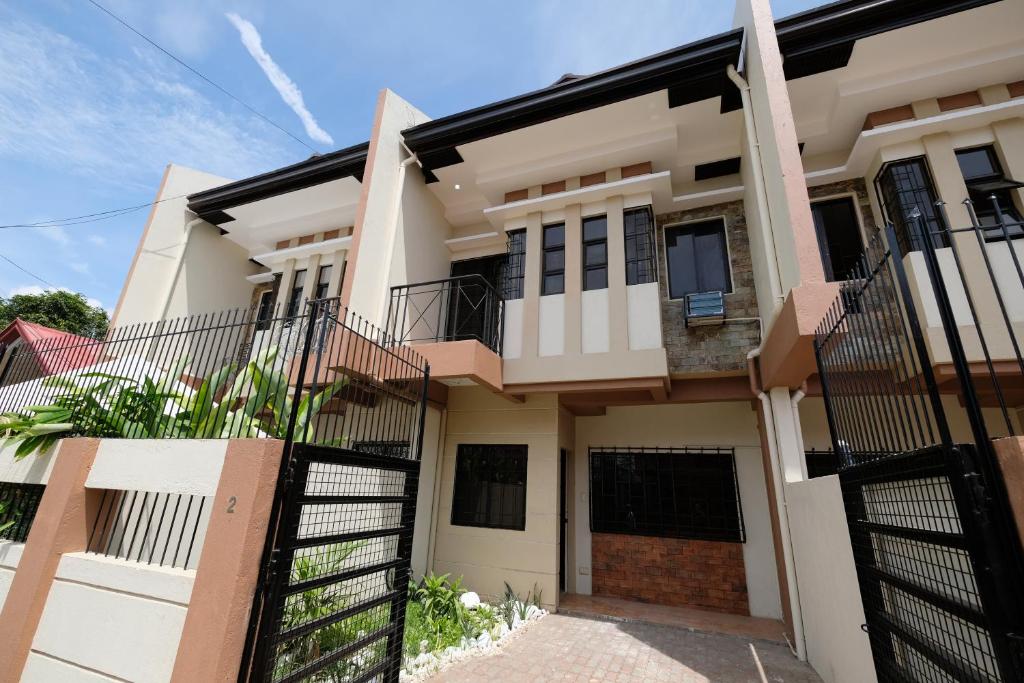 a house with a gate in front of it at Astra Bella Apartment - Unit 2 in Dumaguete
