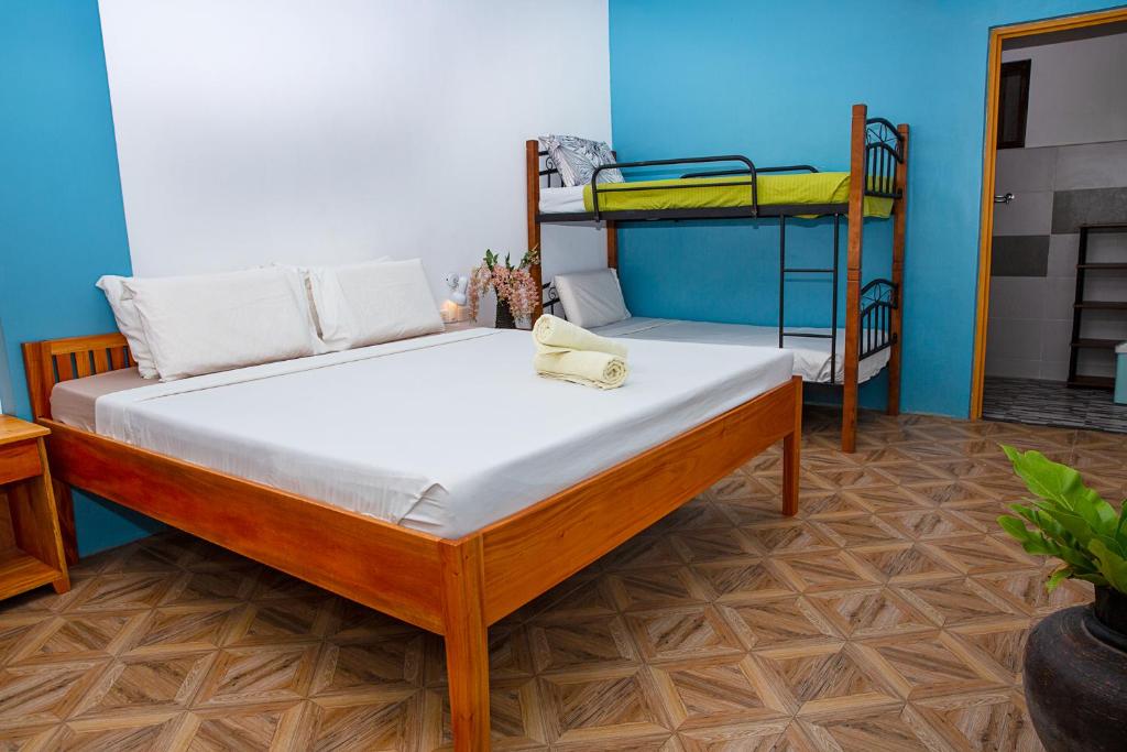 Postel nebo postele na pokoji v ubytování Mayas Guesthouse