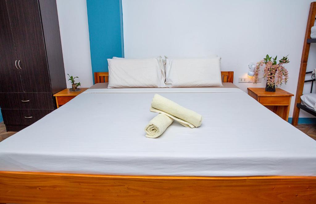 Postel nebo postele na pokoji v ubytování Mayas Guesthouse
