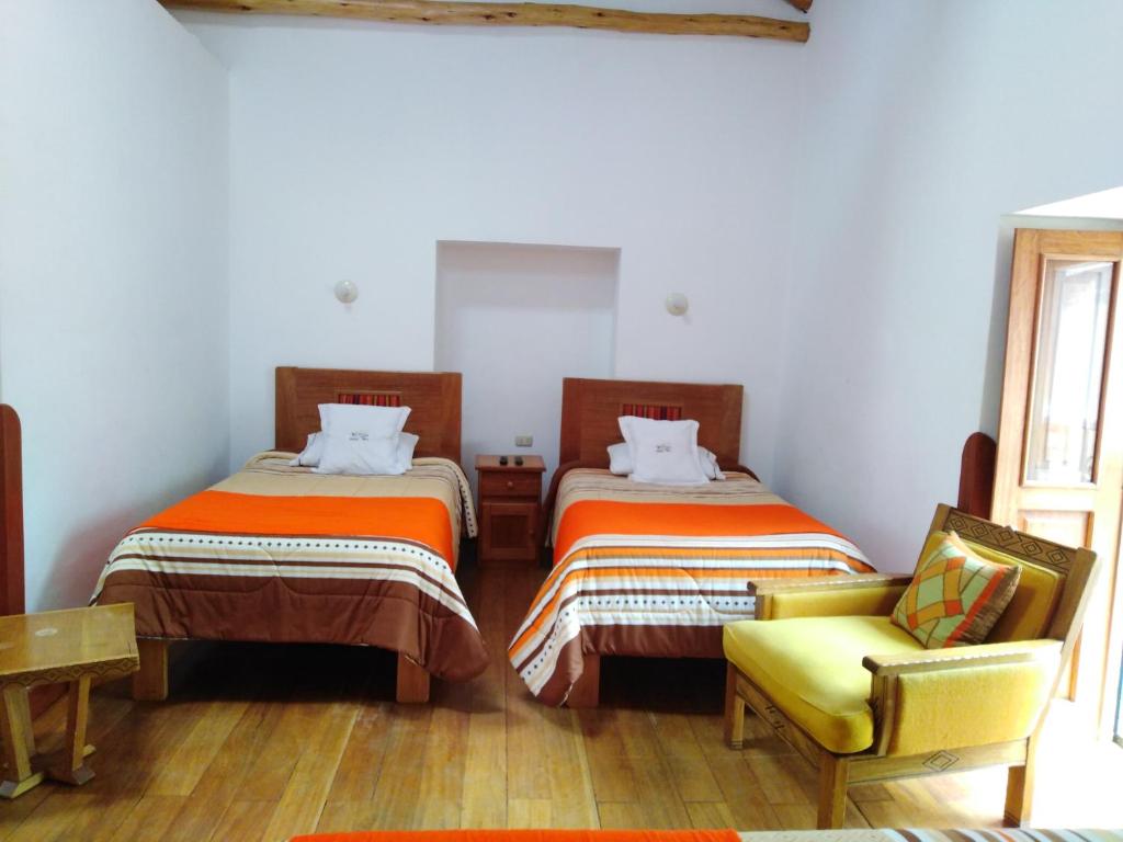 Postel nebo postele na pokoji v ubytování Casa San Pedro Cusco