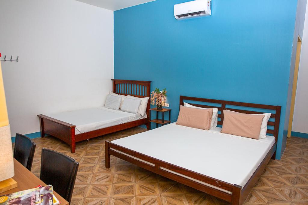 Postel nebo postele na pokoji v ubytování Mayas Guesthouse