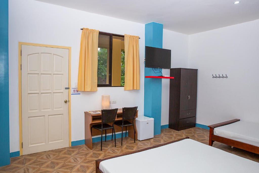 Postel nebo postele na pokoji v ubytování Mayas Guesthouse