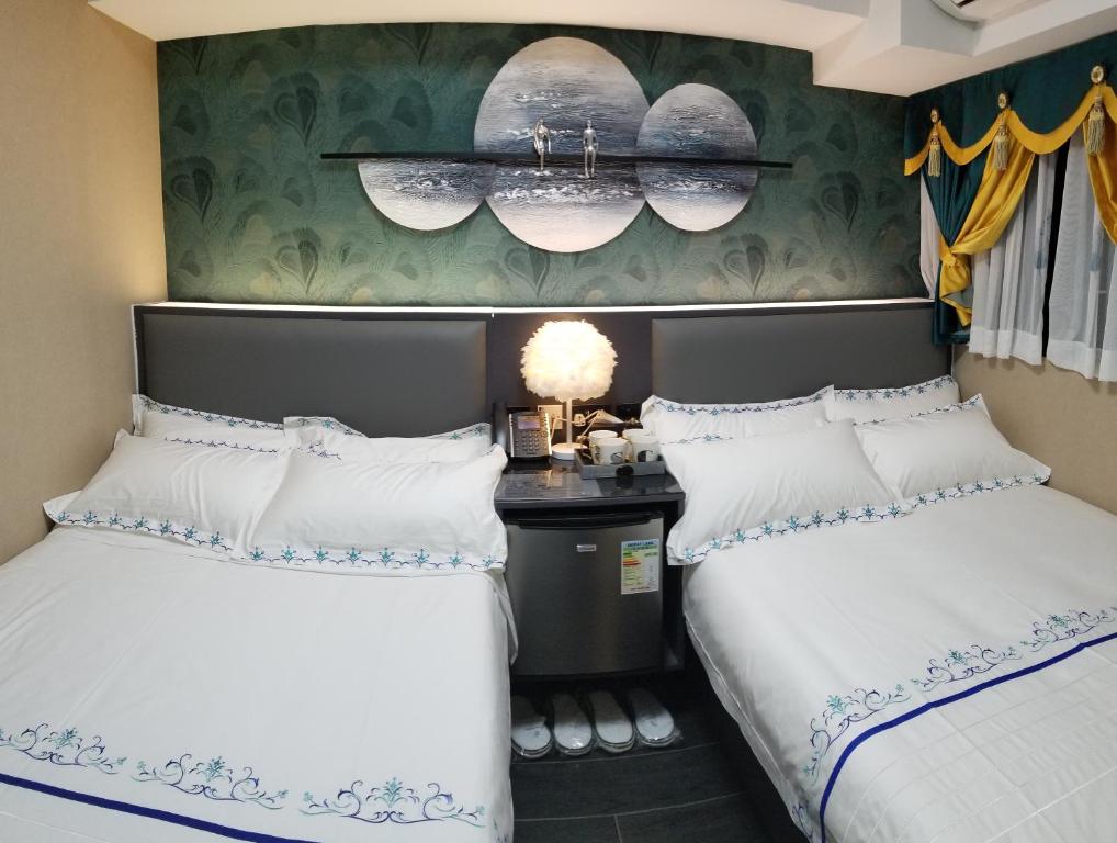 Postel nebo postele na pokoji v ubytování Star City Hotel