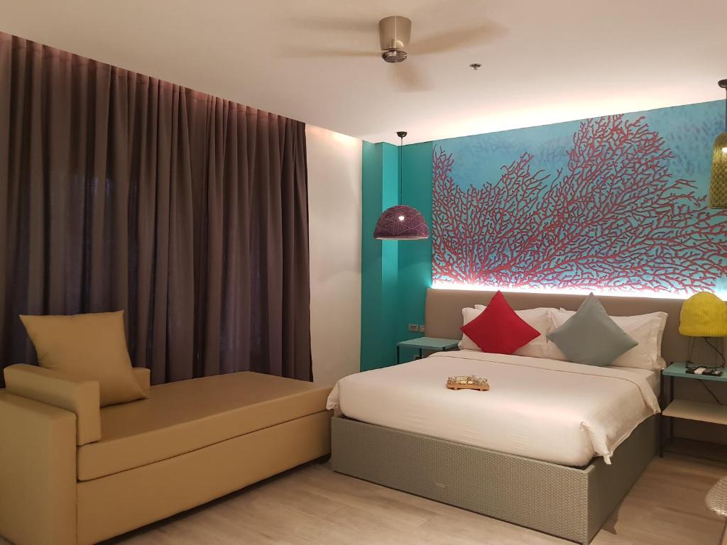 Llit o llits en una habitació de Lagùn Hotel